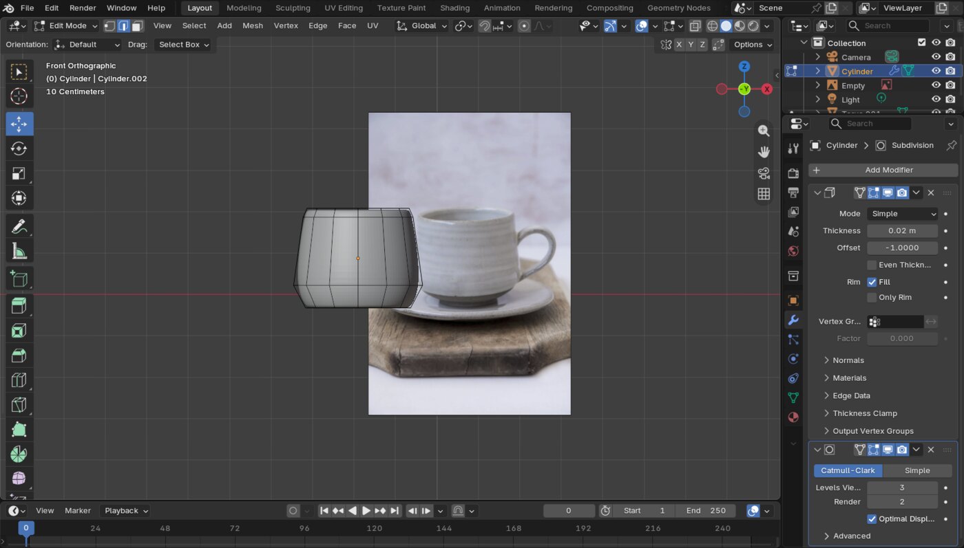 A hand-sculpted mug in the Blender viewport